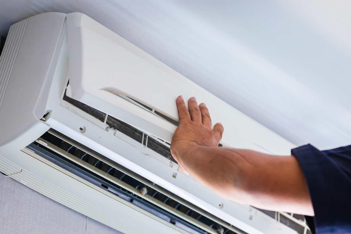 AC technician servicing a home cooling system in Albuquerque